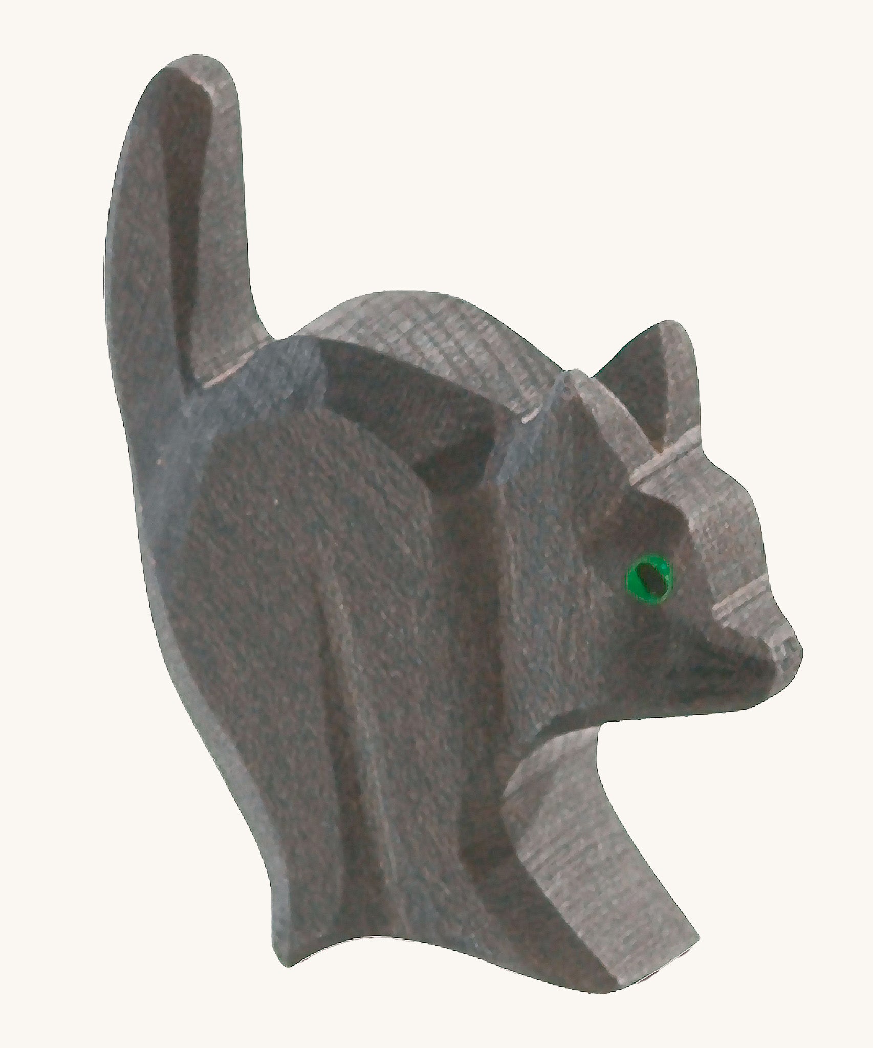 A black wooden Ostheimer cat for the witch figure on a cream background.