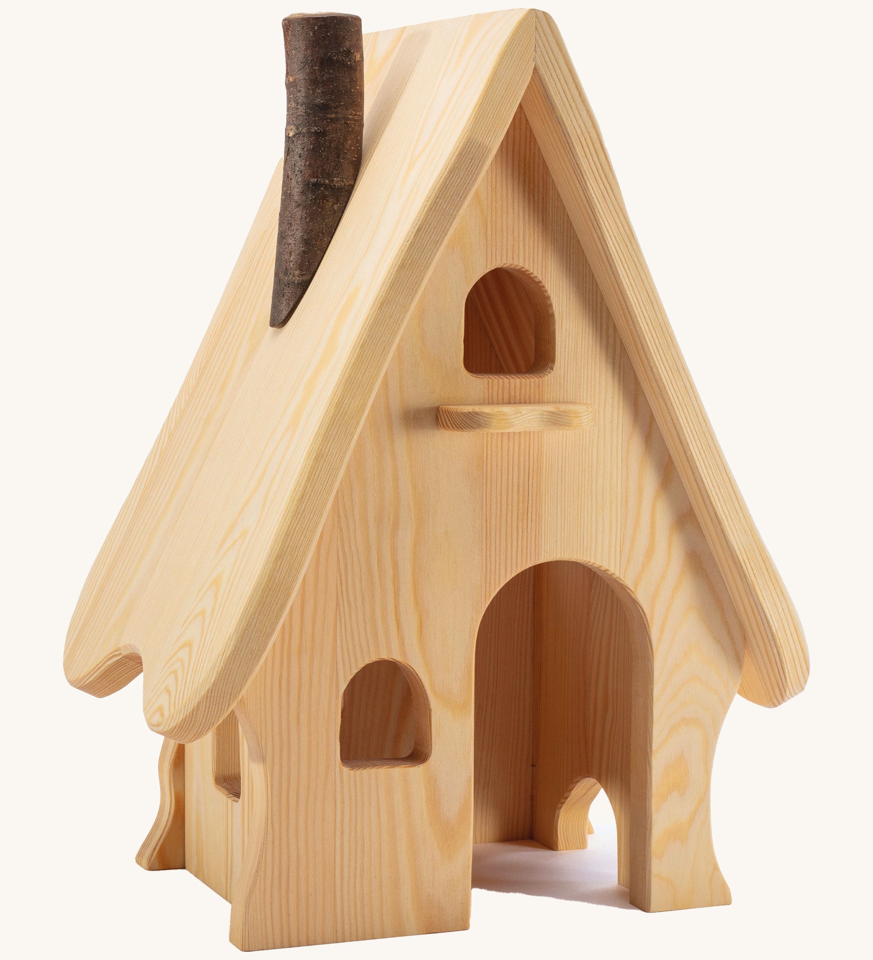 A wooden Ostheimer fairy tale dolls house on a cream background.