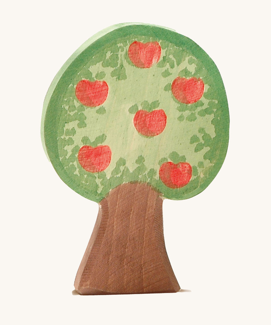 Ostheimer apple tree wooden toy figure on a plain background. The side with apples are shown. 