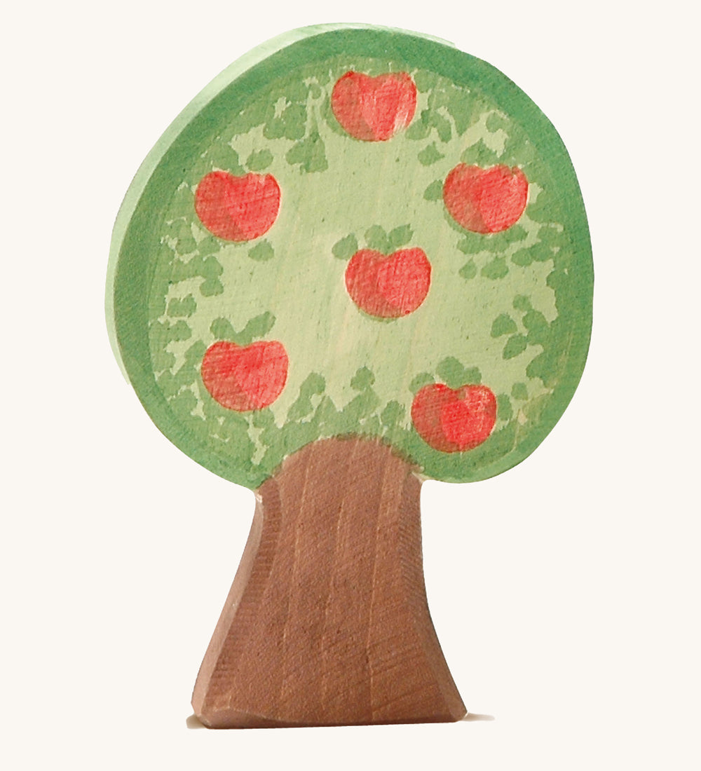 Ostheimer apple tree wooden toy figure on a plain background. The side with apples are shown. 