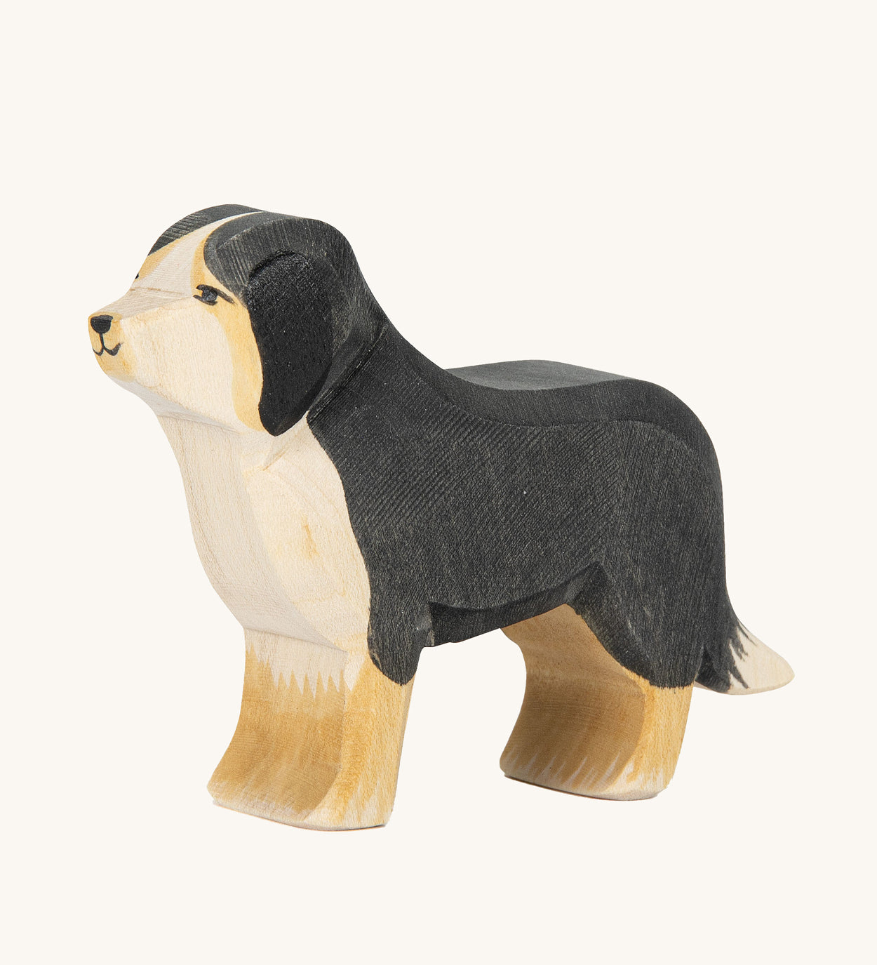 Ostheimer Bernese Mountain Dog wooden toy figure on a plain background. 