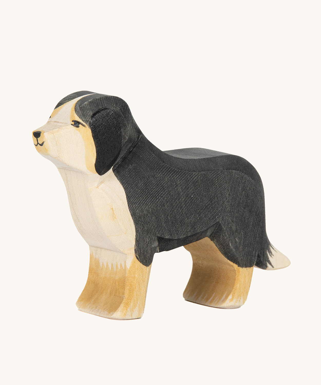 Ostheimer Bernese Mountain Dog wooden toy figure on a plain background. 