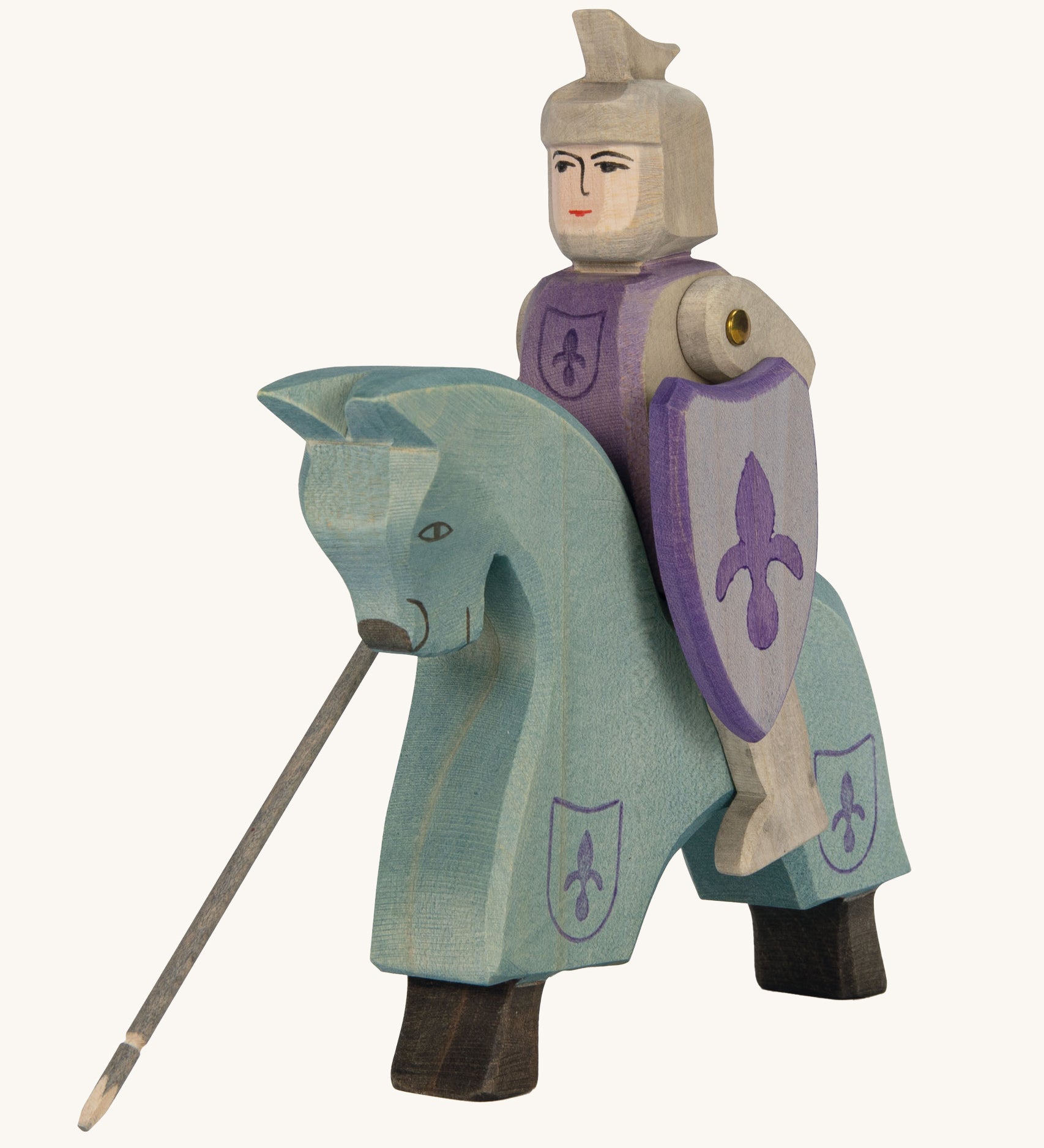 Ostheimer blue wooden horse figure with a wooden Ostheimer blue knight sitting on the horse on a cream background