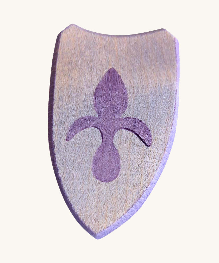 A blue wooden shield with a emblem for a knight on a cream background