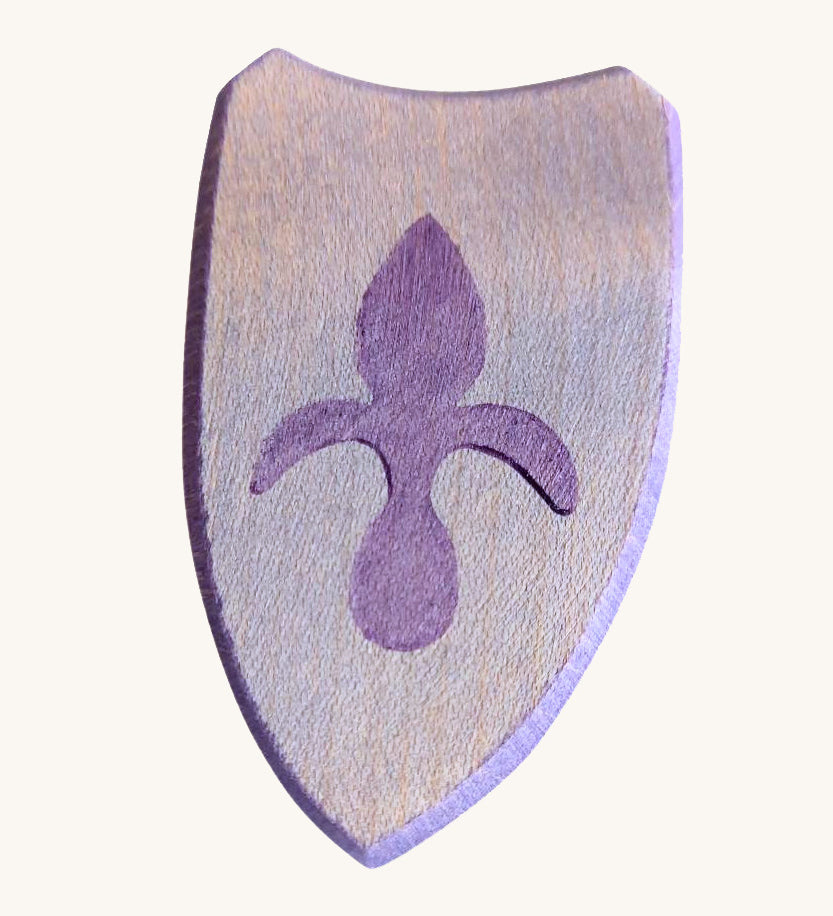 A blue wooden shield with a emblem for a knight on a cream background