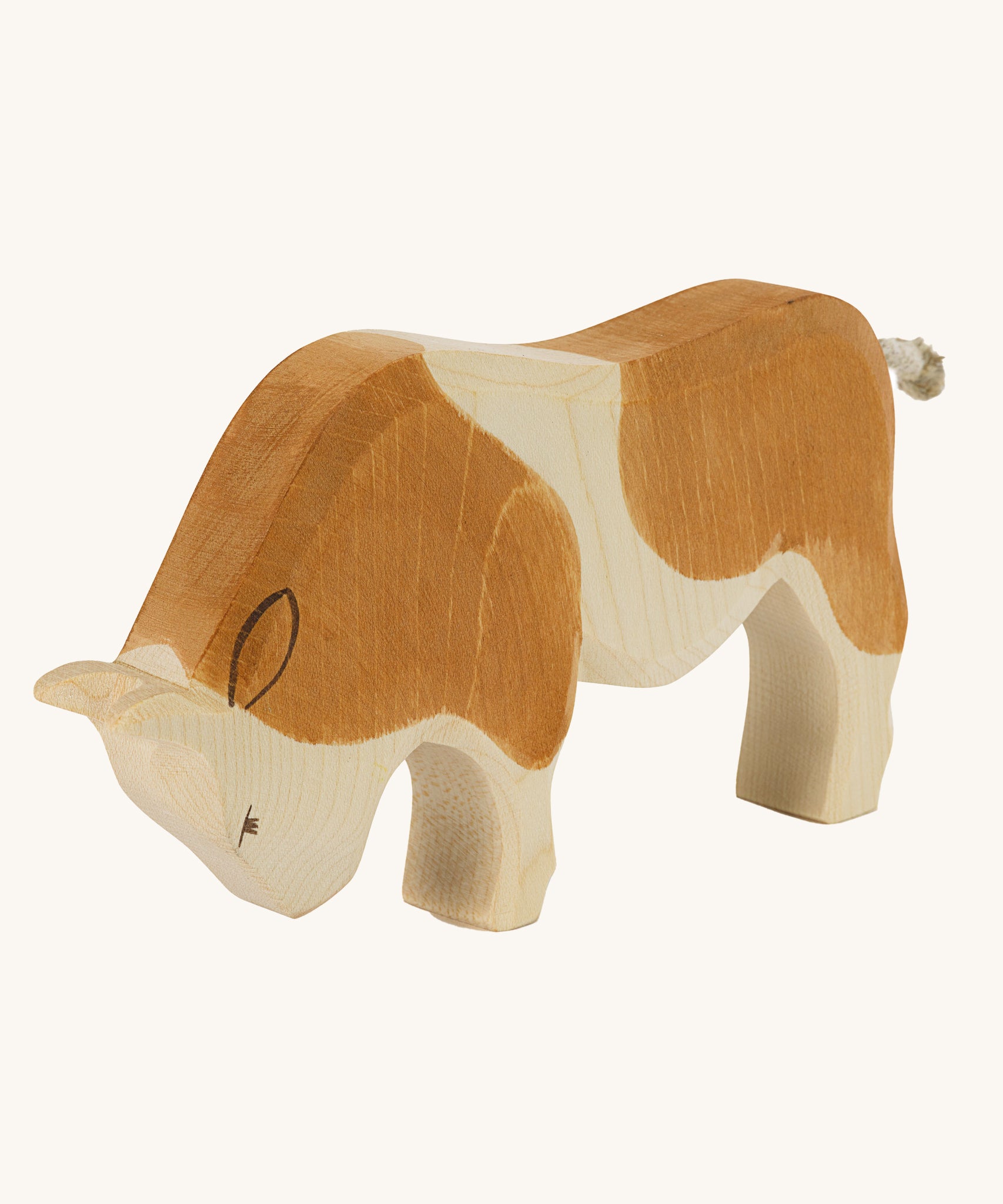 Ostheimer Brown Ox wooden toy on a plain background. 