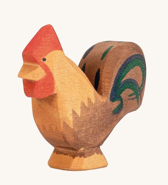 Ostheimer Brown Rooster wooden toy figure on a plain background. 