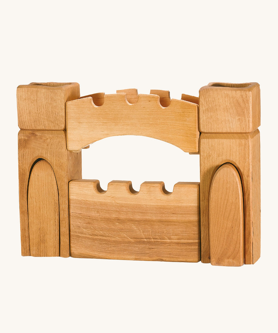 Ostheimer children's handmade wooden castle gate and towers set on a cream background