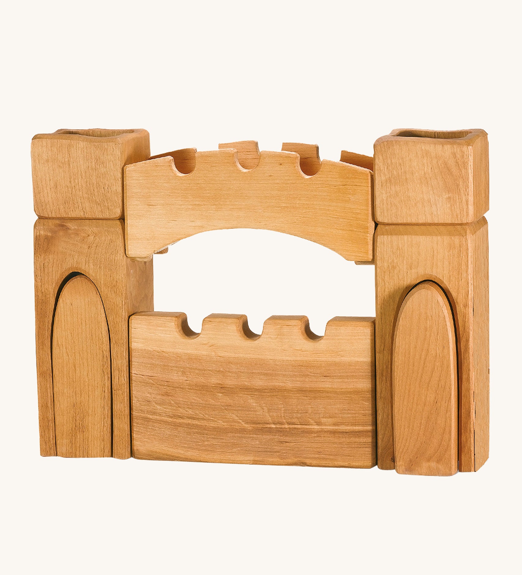 Ostheimer children's handmade wooden castle gate and towers set on a cream background