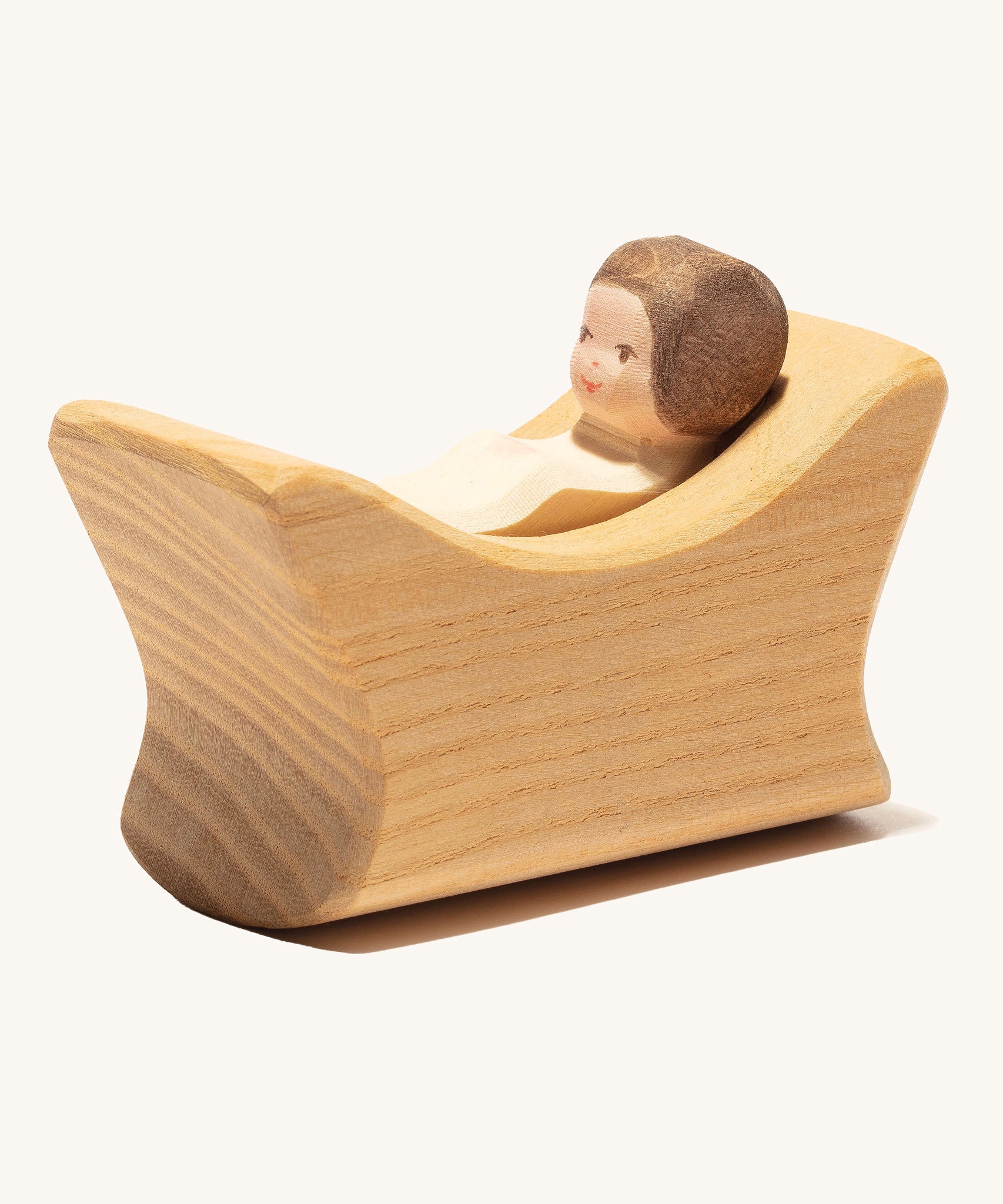 Ostheimer Child In Cradle on a plain background. 