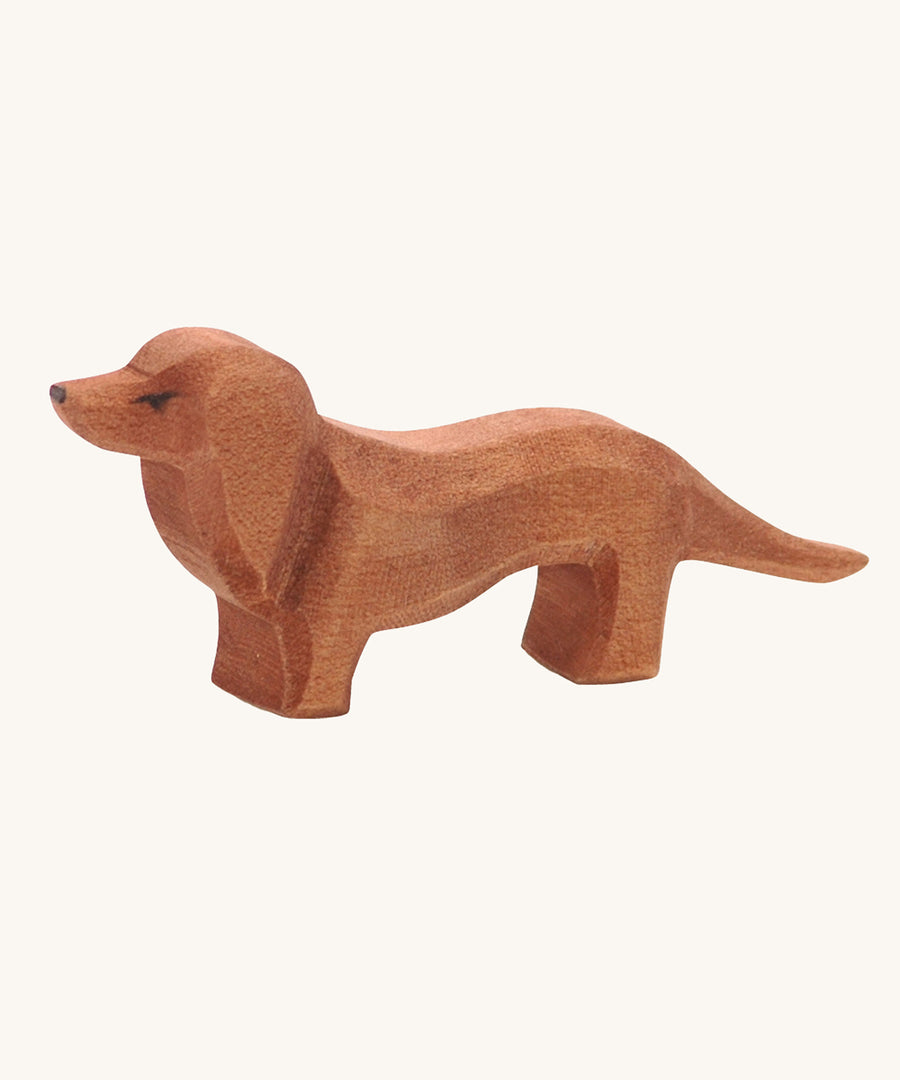 Ostheimer Dachshund dog toy figure on a plain background. 