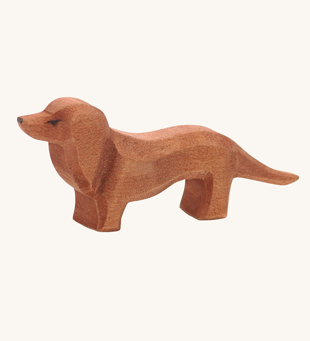 Ostheimer Dachshund dog toy figure on a plain background. 