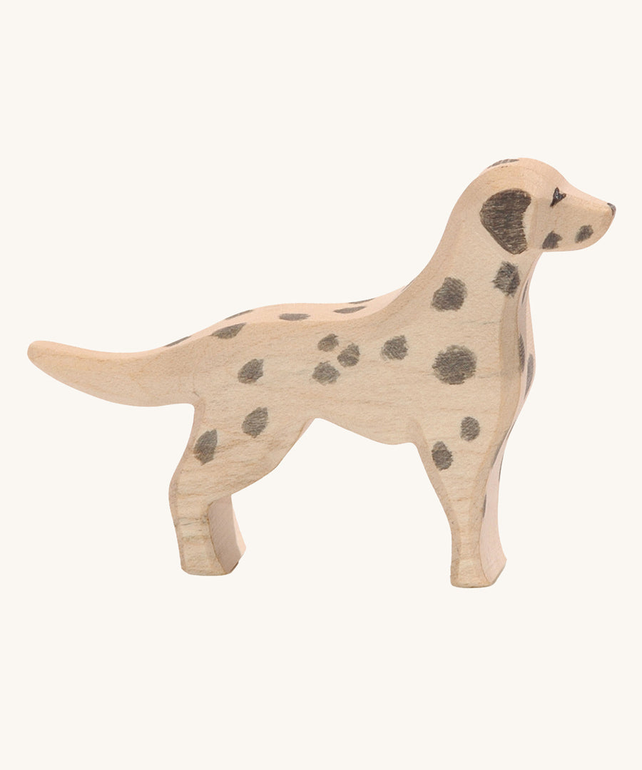 Ostheimer dalmatian dog wooden toy figure on a plain background. 