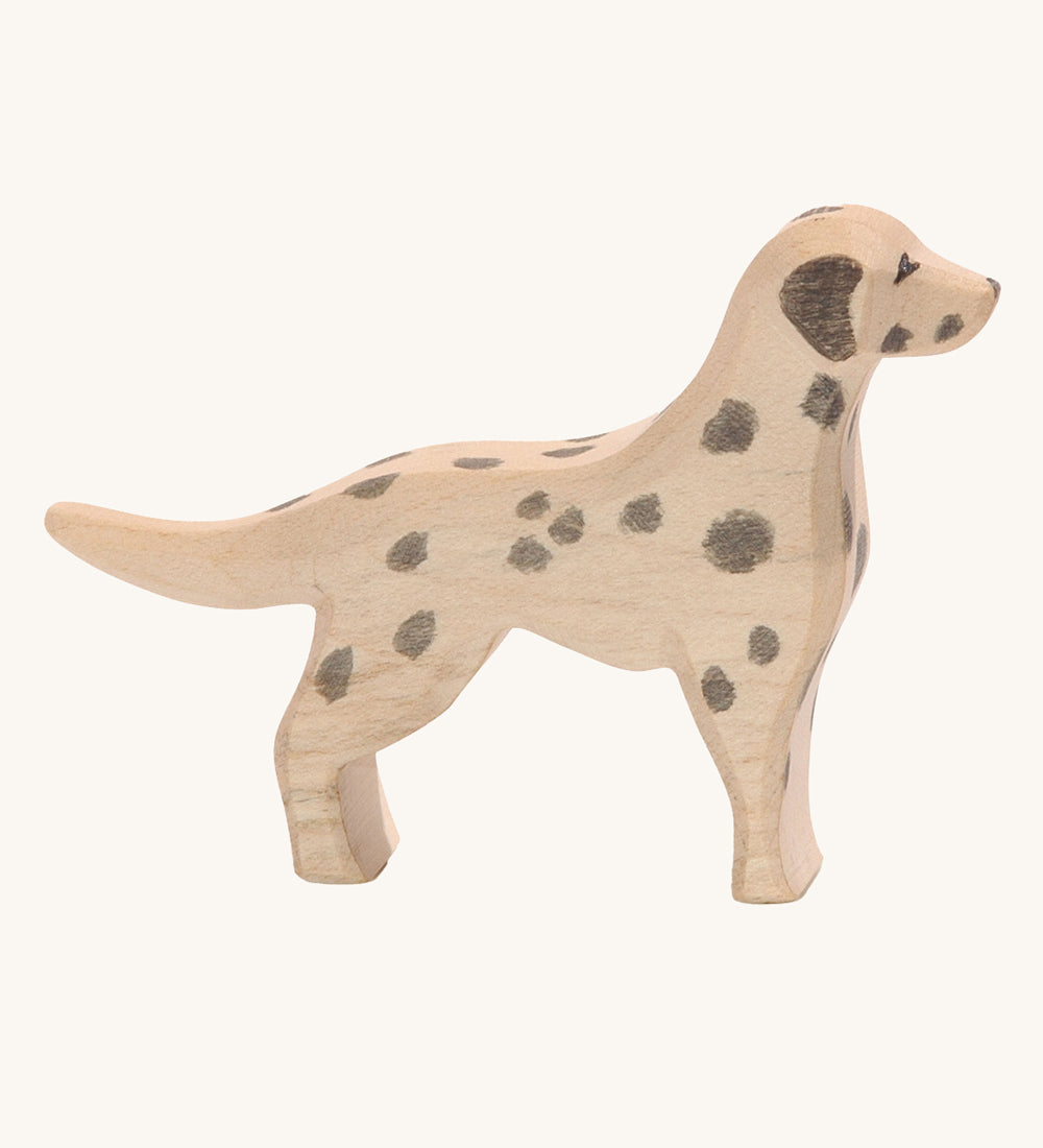 Ostheimer dalmatian dog wooden toy figure on a plain background. 