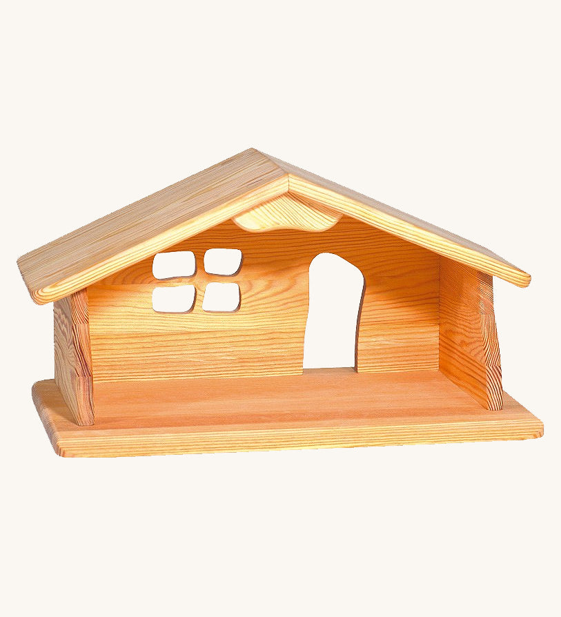 Ostheimer dolls house wooden toy on a plain background.