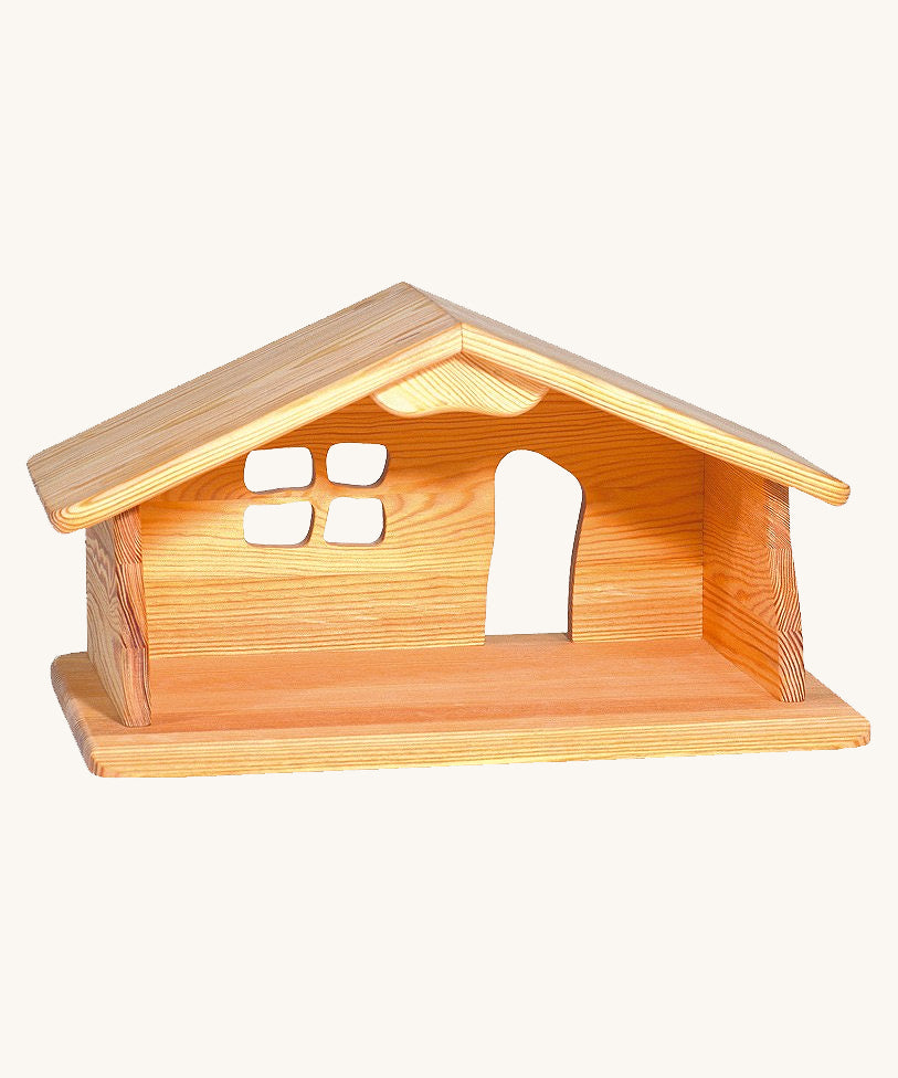 Ostheimer dolls house wooden toy on a plain background.