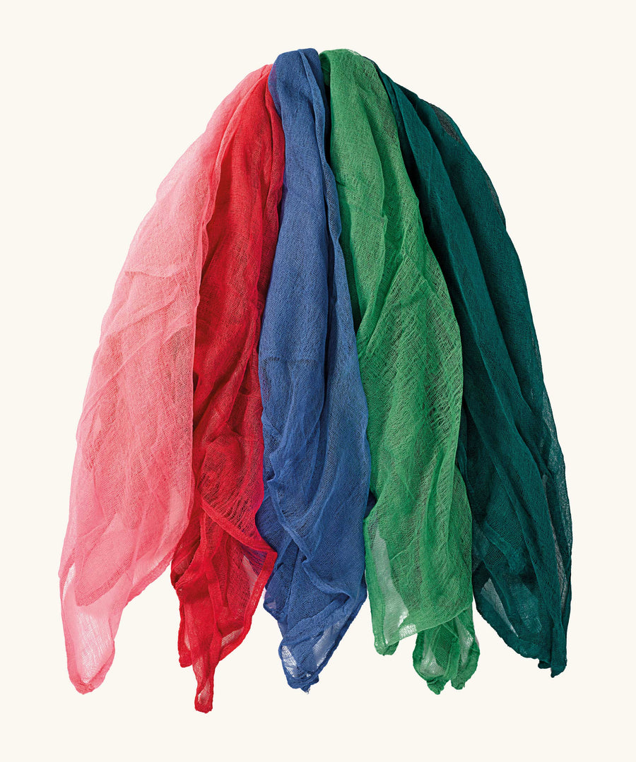 Ostheimer Fairy Tale Decoration Scarves in a set of 5 scarves all with different colours on a plain background. The scarves are pink, red, 2 different green tones, a blue. 