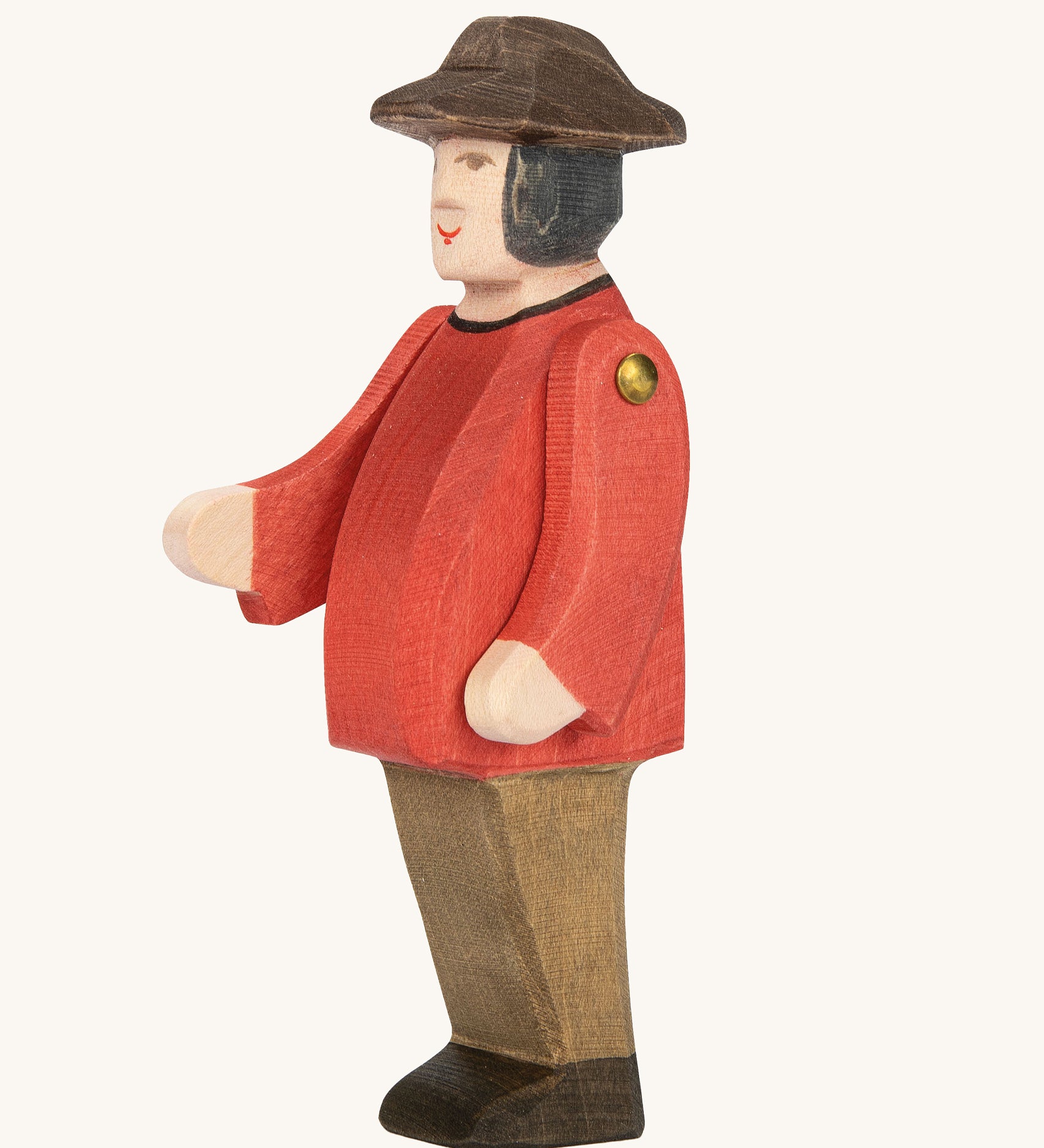 Ostheimer Farmer Man on a plain background. The wooden toy figure has movable arms and has a painted red top. 