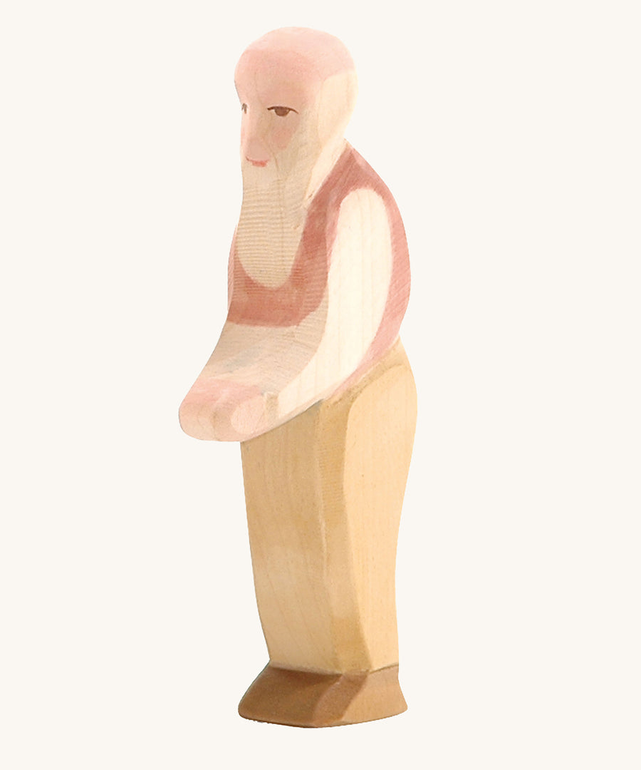 Ostheimer Grandfather wooden toy figure on a plain background. 