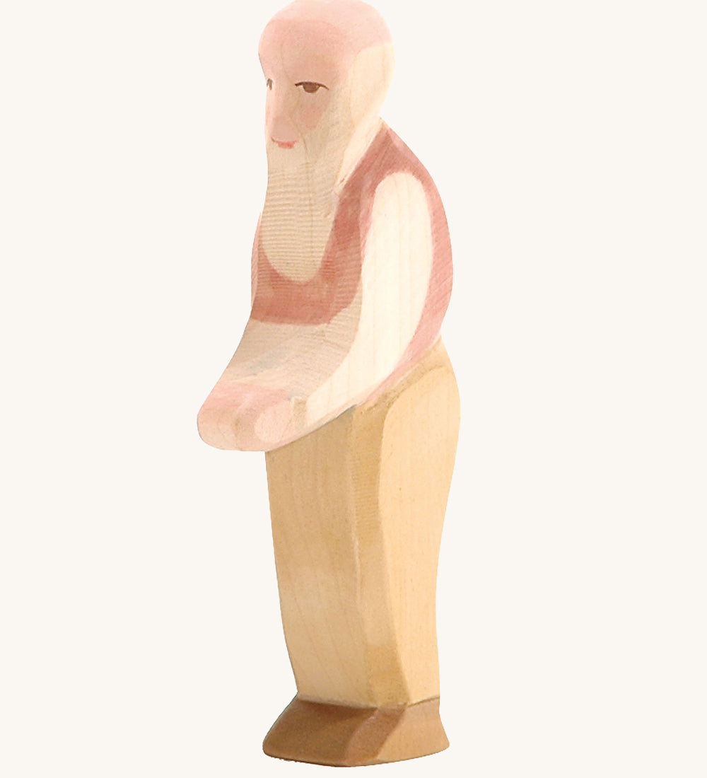 Ostheimer Grandfather wooden toy figure on a plain background. 