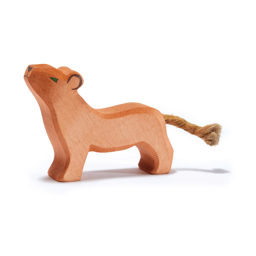 Ostheimer handmade childrens wooden lion cub toy with its head up on a white background