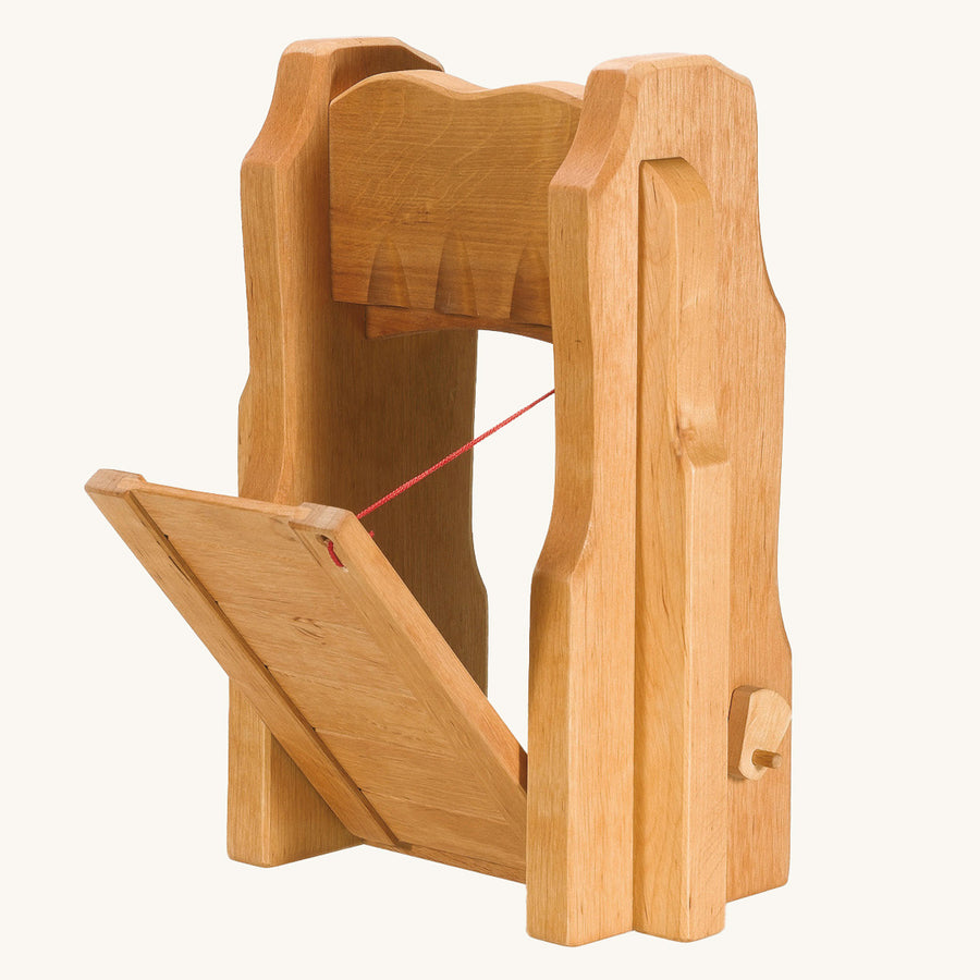 Ostheimer kids handmade wooden castle drawbridge set on a beige background