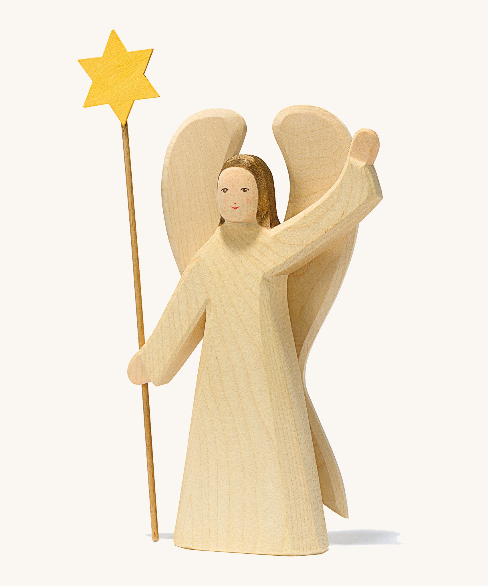 A large waving angel holding a staff with a yellow star on a cream background.