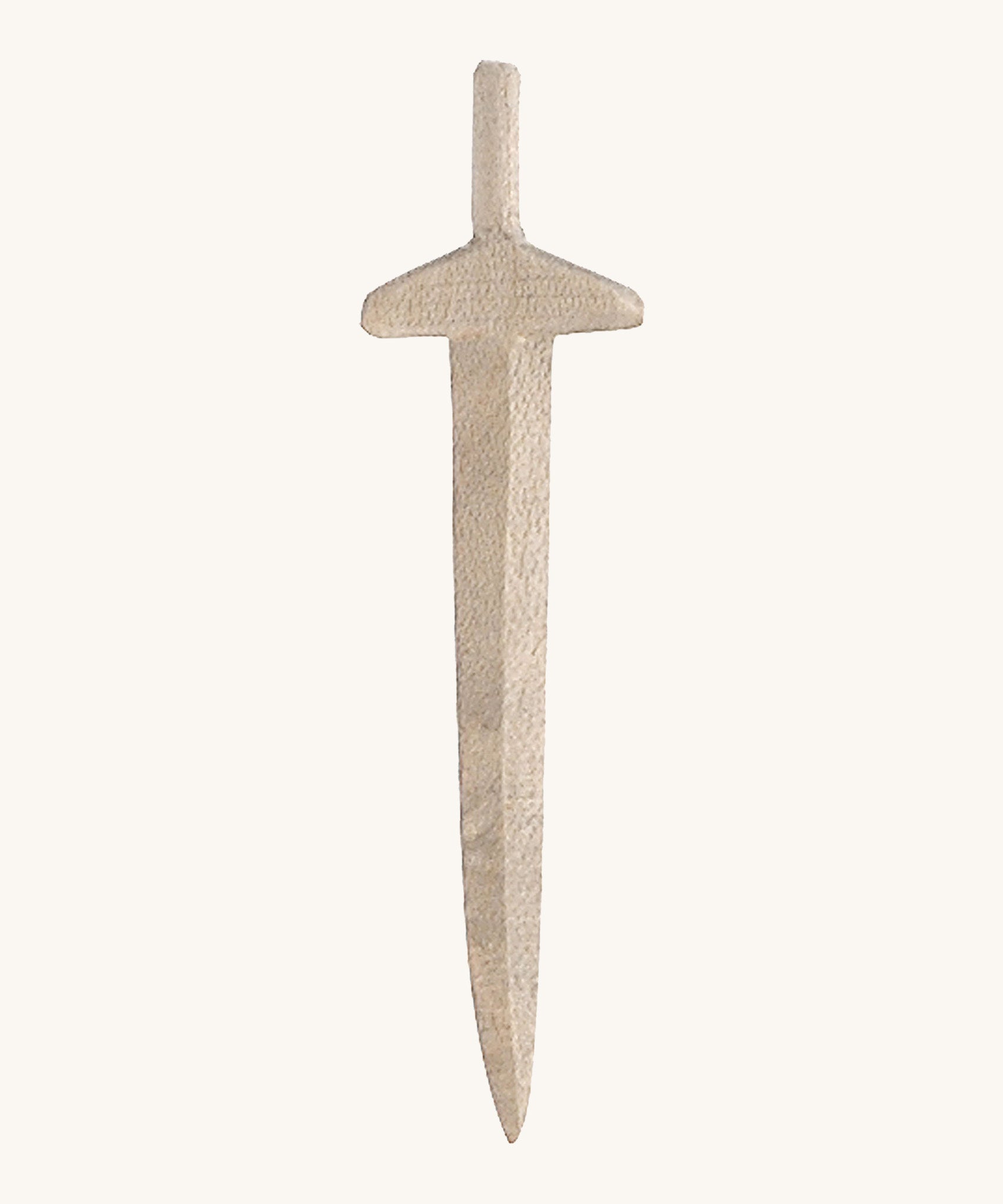 A long wooden sword on a cream background