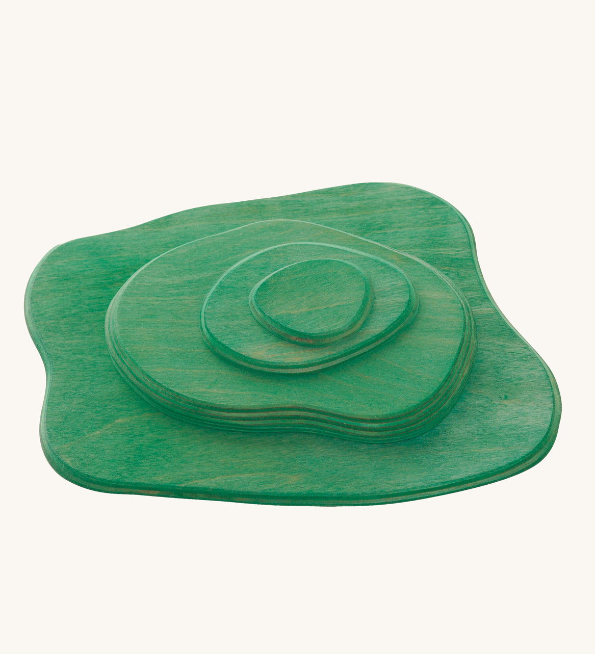 Ostheimer green Meadow wooden toy plates on a plain background. 