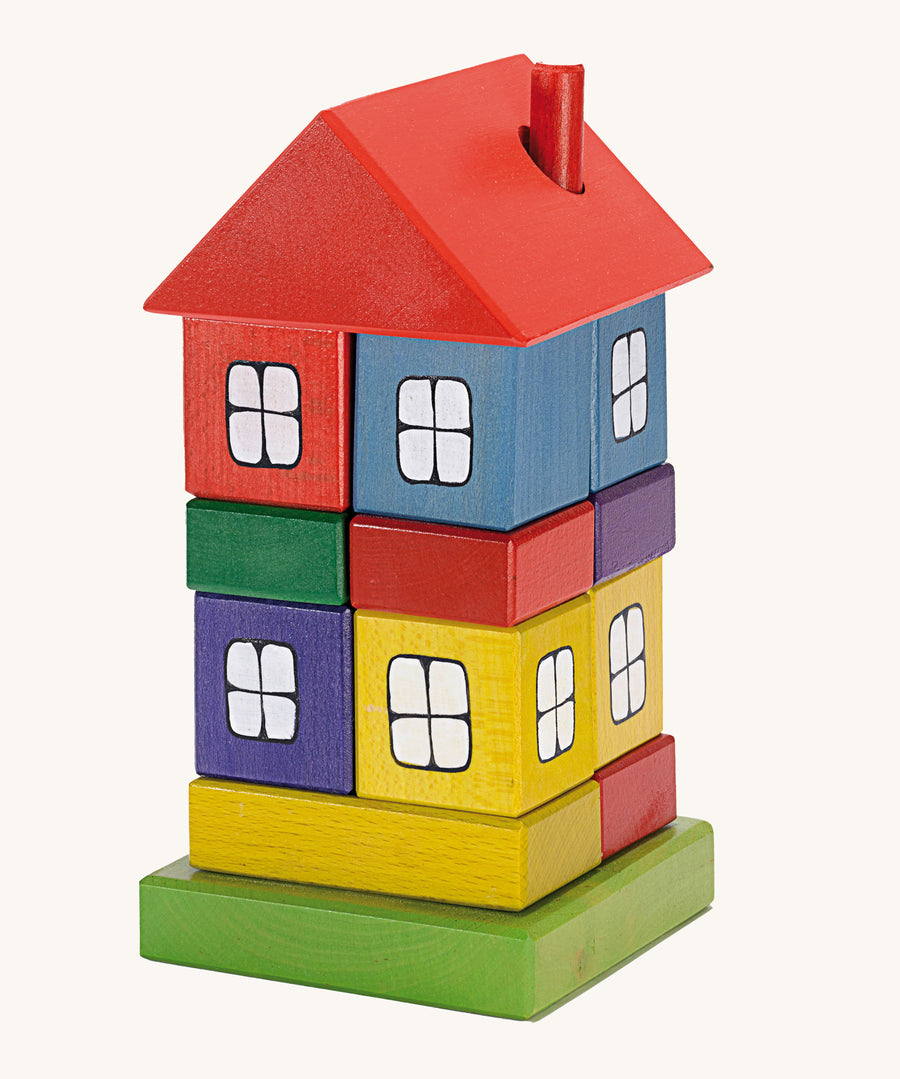 Ostheimer Multi Coloured Block House wooden toy on a plain background. 