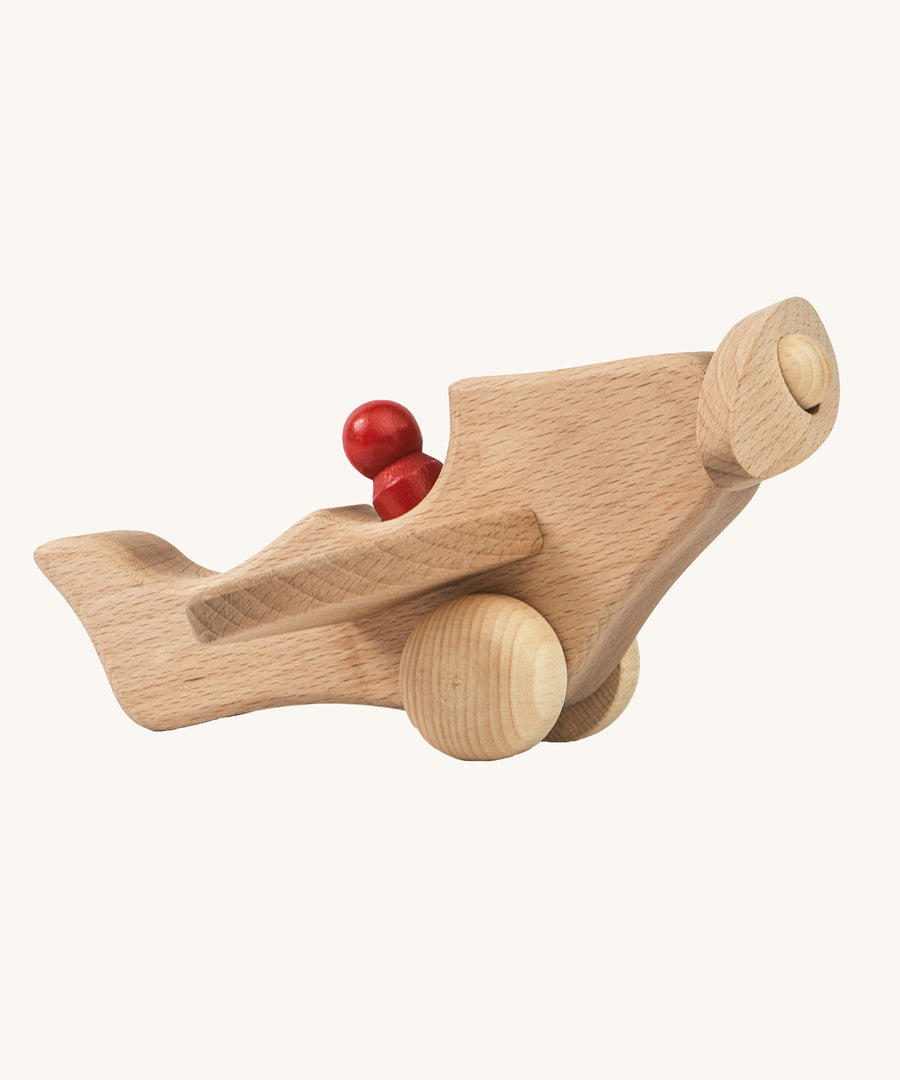 Ostheimer Natural Open Plane With 1 red Person on a plain background. 