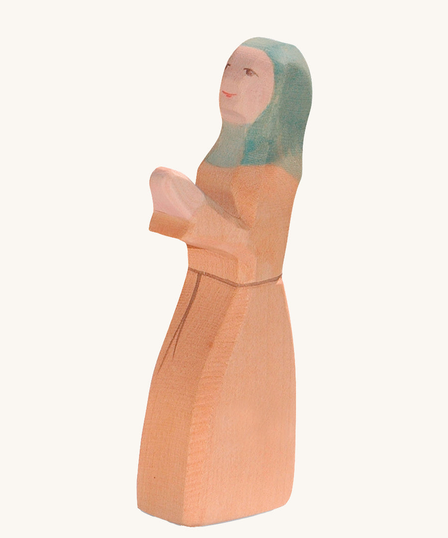 Ostheimer Noah's Wife wooden toy figure on a plain background. 