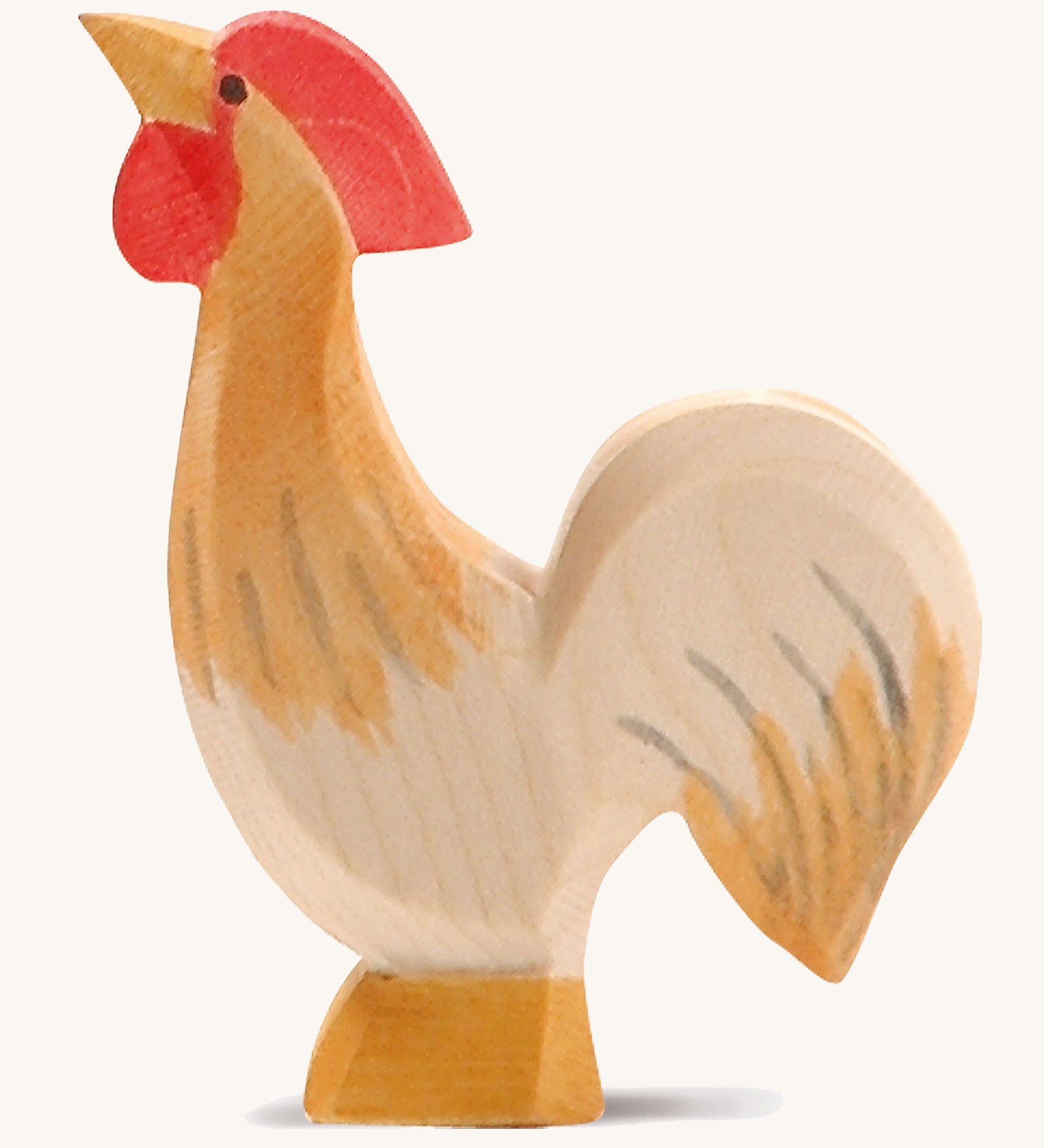 A ochre wooden Ostheimer rooster figure on a cream background.