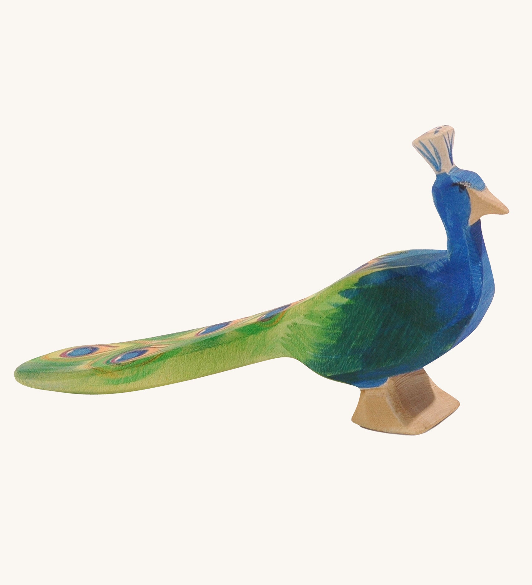 Ostheimer peacock wooden toy figure on a plain background.