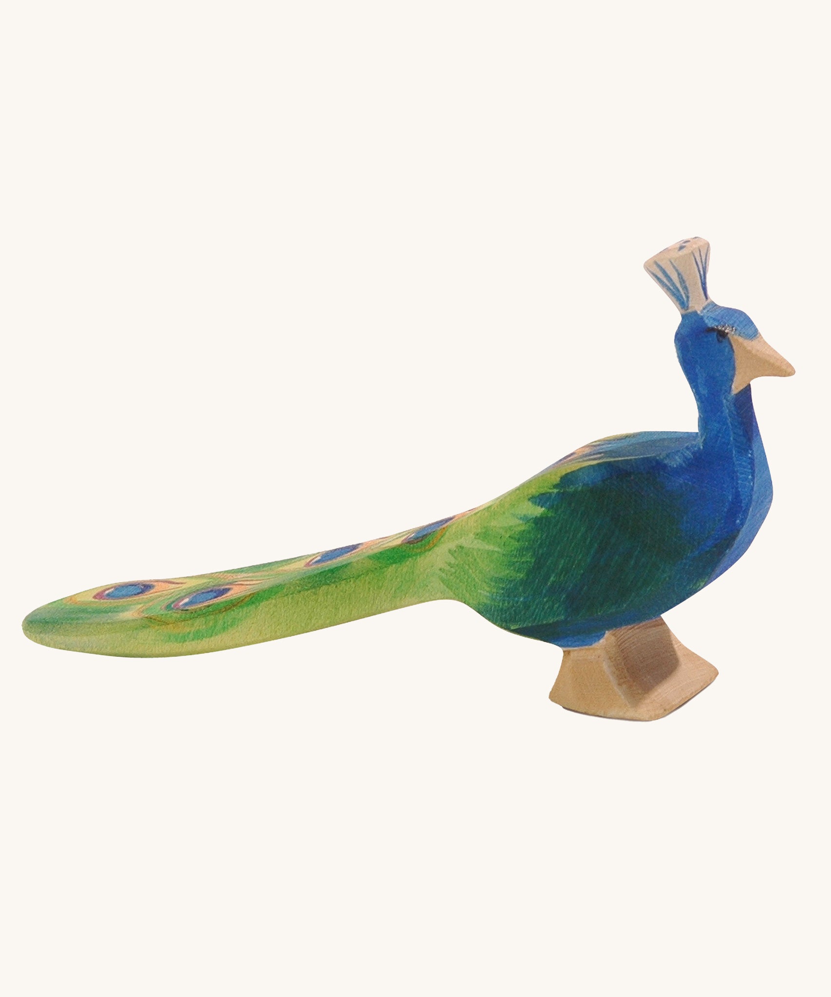 Ostheimer peacock wooden toy figure on a plain background.