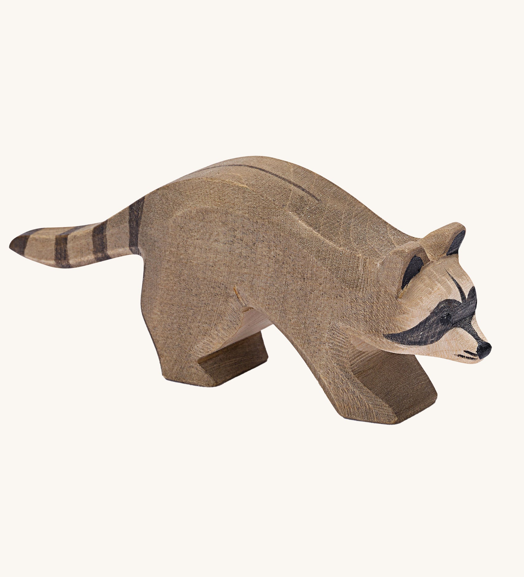 Ostheimer Running Raccoon wooden toy figure on a plain background.