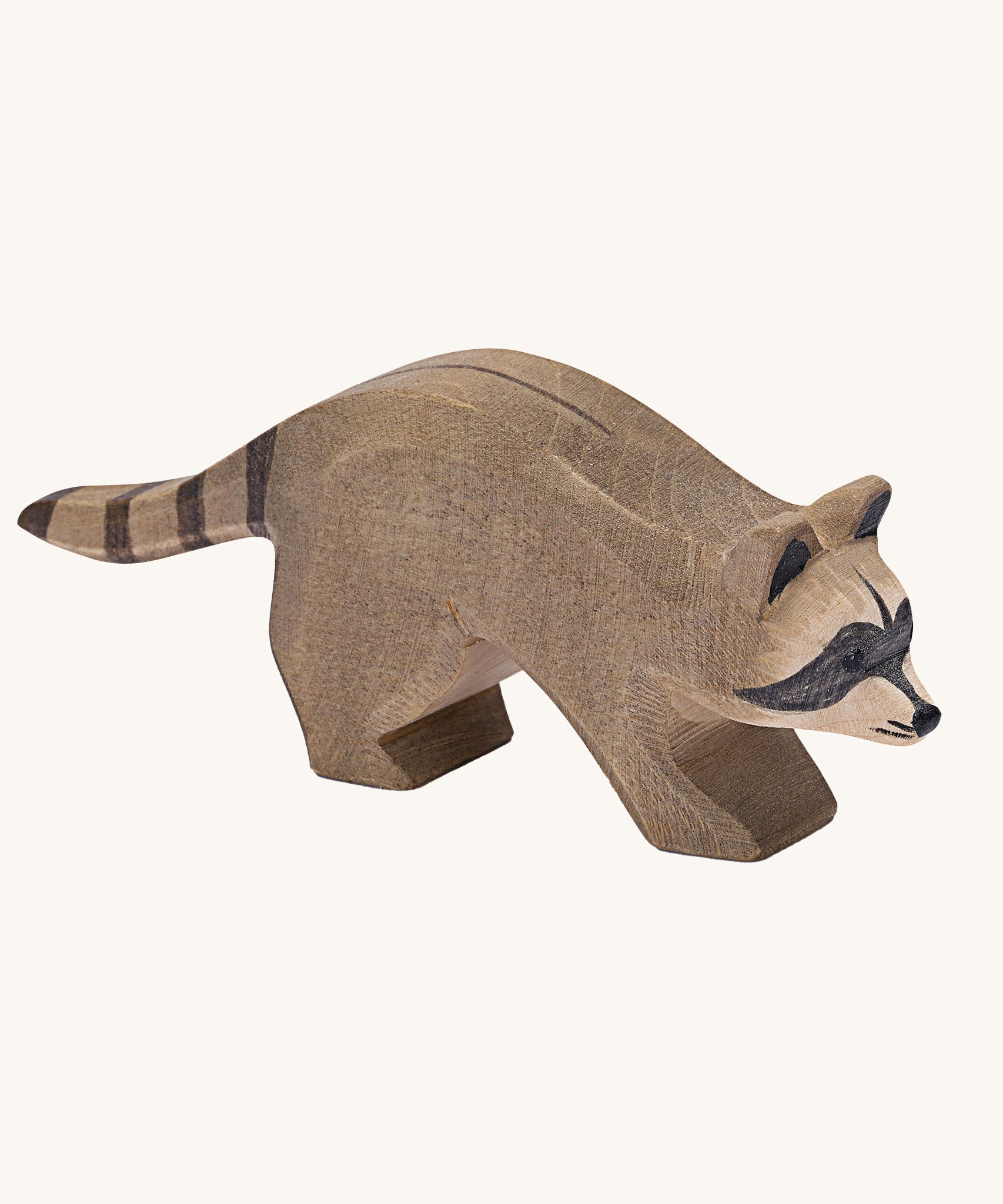 Ostheimer Running Raccoon wooden toy figure on a plain background.