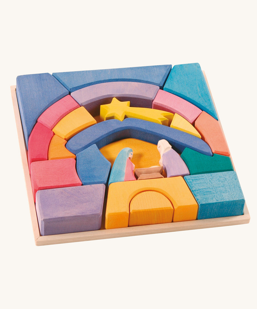 The Ostheimer Rainbow Nativity Block set in the wooden frame they come with on a plain background.