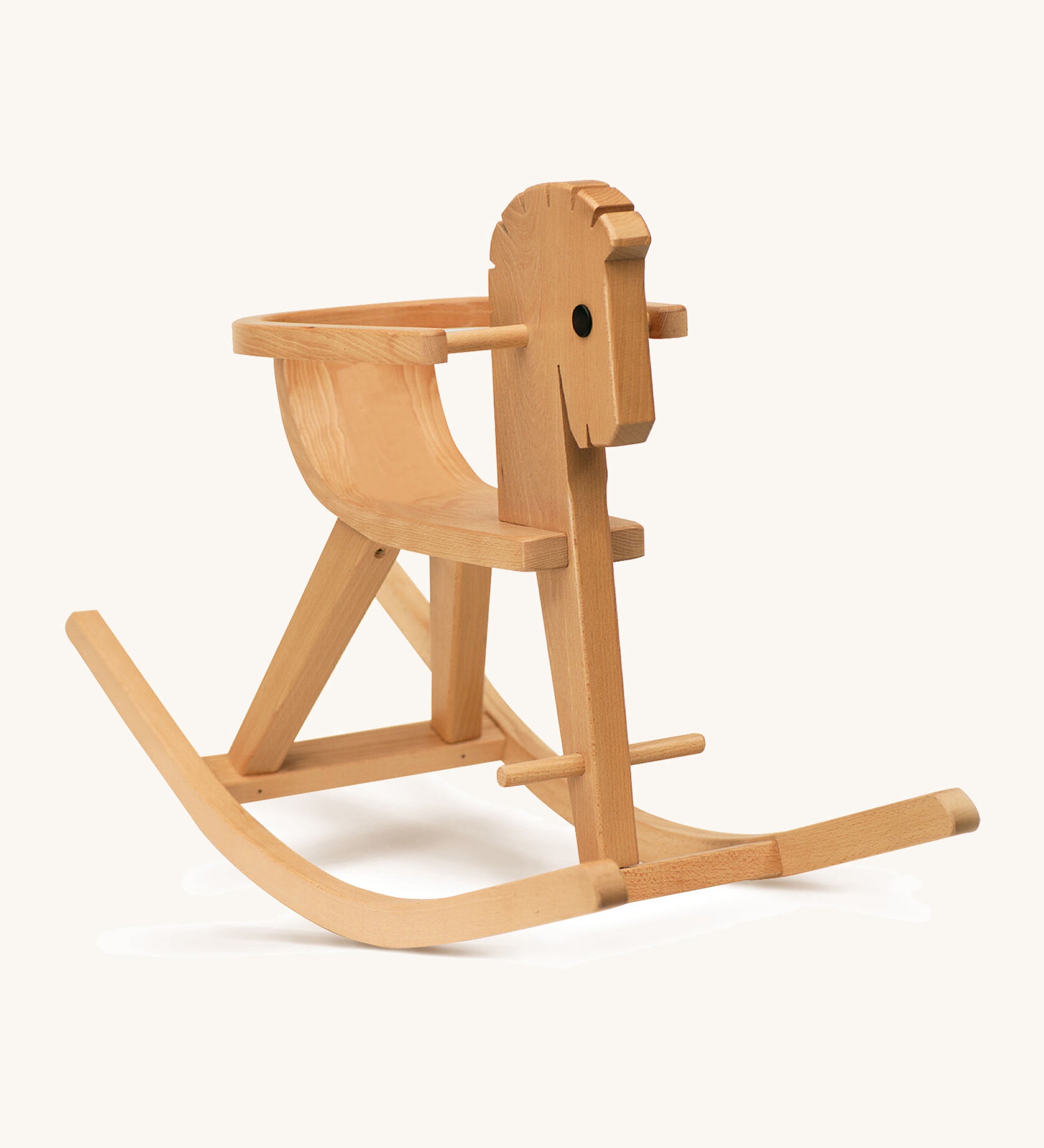 A wooden rocking horse with arm rests on a cream background