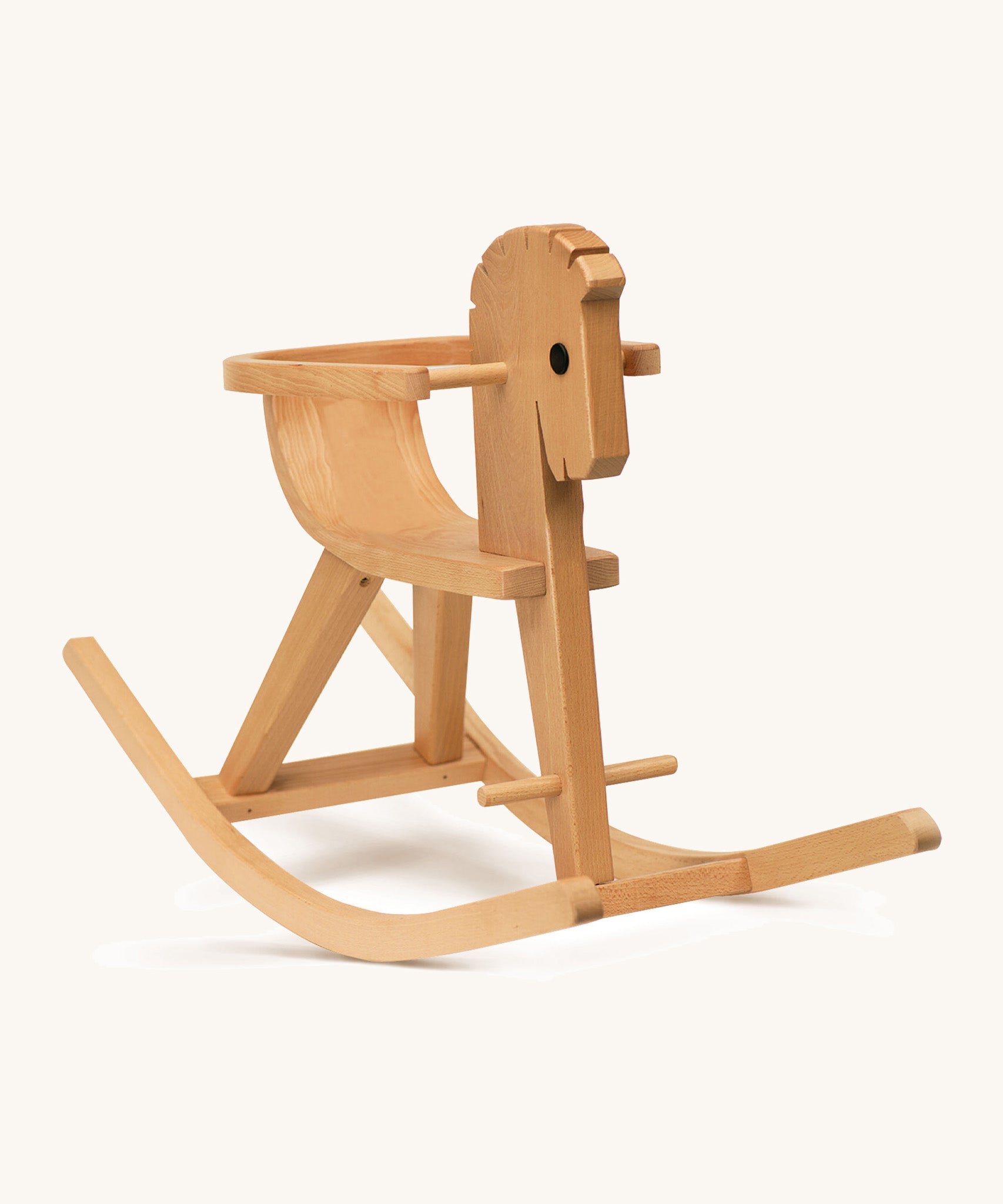 A wooden rocking horse with arm rests on a cream background