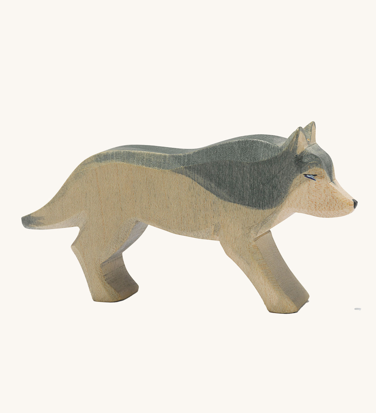 Ostheimer wooden running wolf on a plain background. 