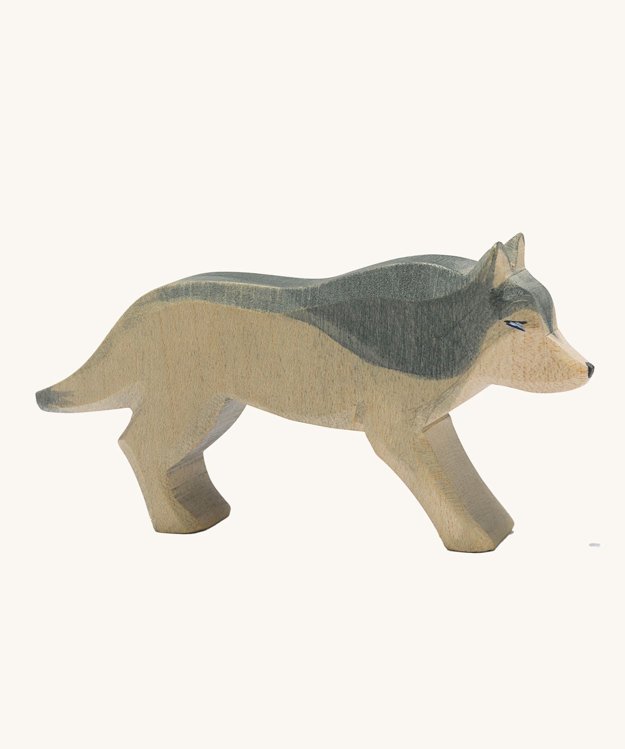 Ostheimer wooden running wolf on a plain background. 