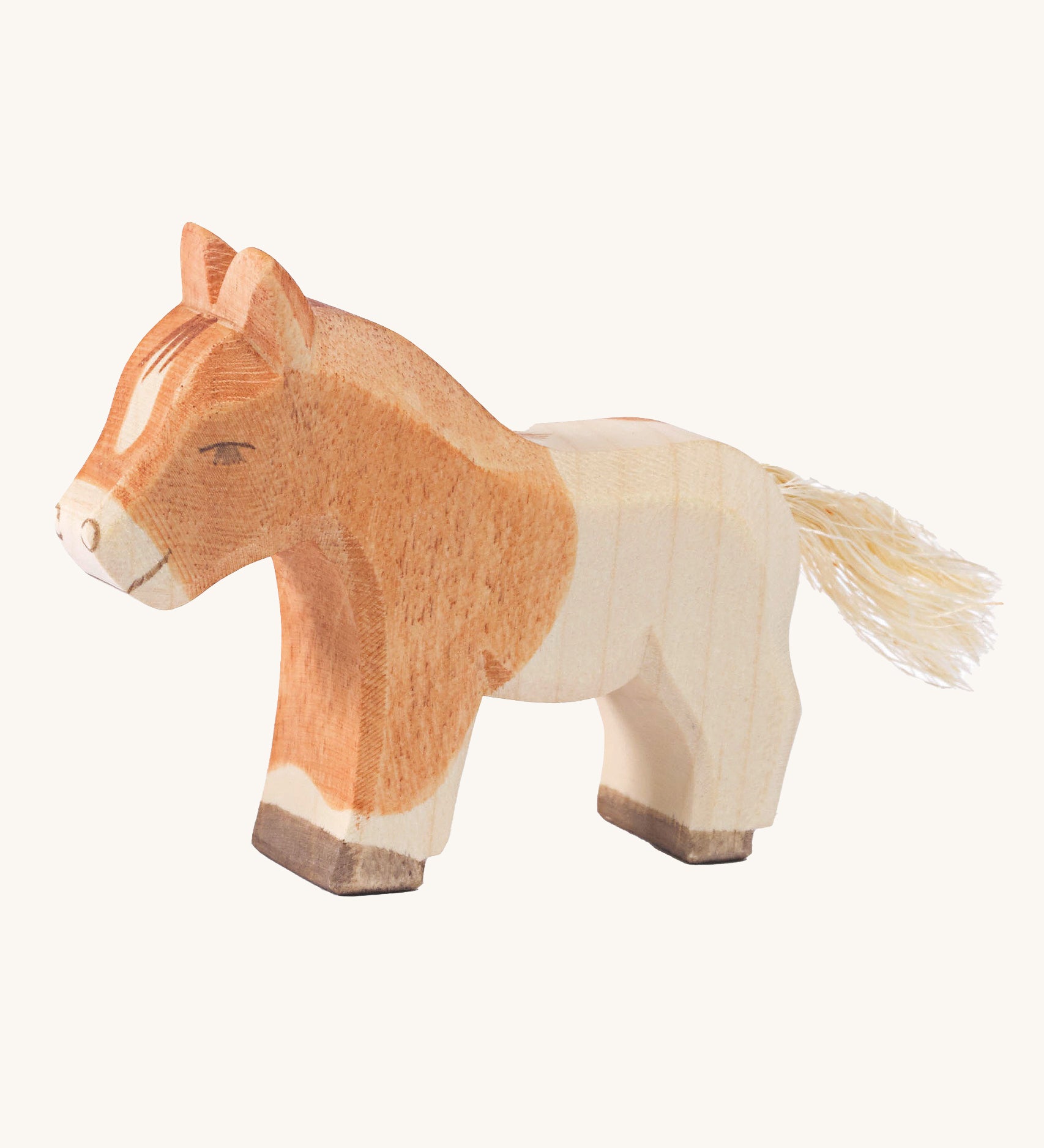 Ostheimer Shetland Colt wooden toy figure on a plain background. 