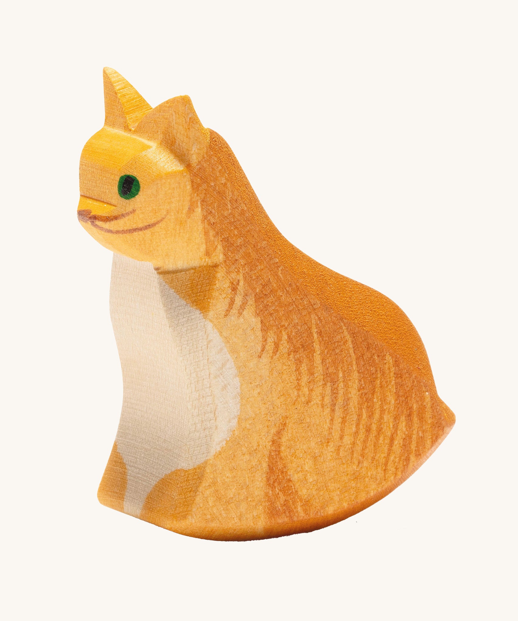 Ostheimer sitting cat wooden toy figure on a plain background.