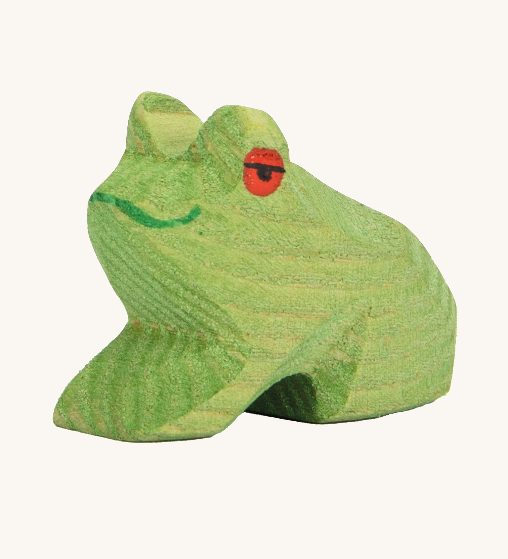 Ostheimer Sitting Frog wooden toy figure on a plain background. 