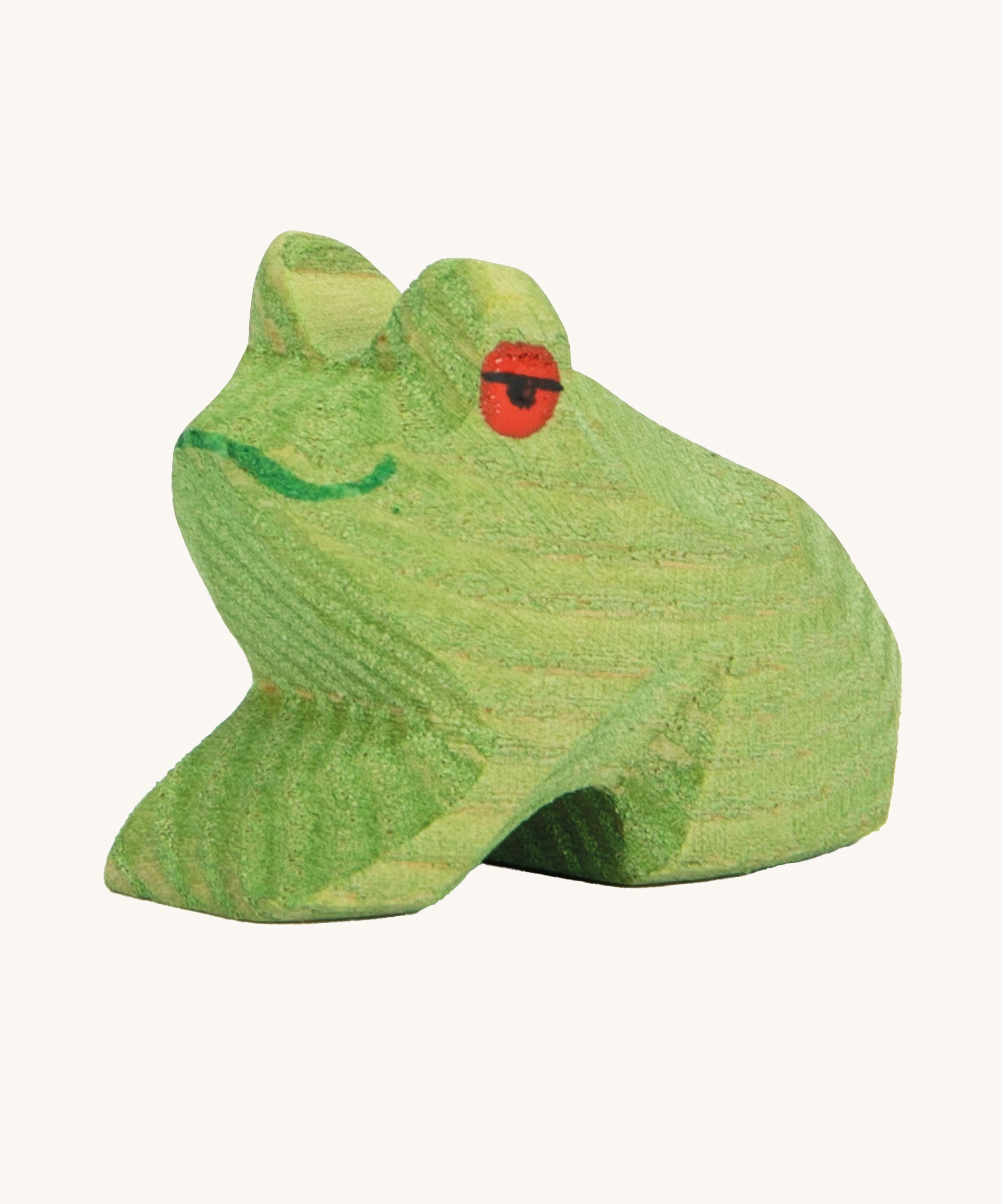 Ostheimer Sitting Frog wooden toy figure on a plain background. 