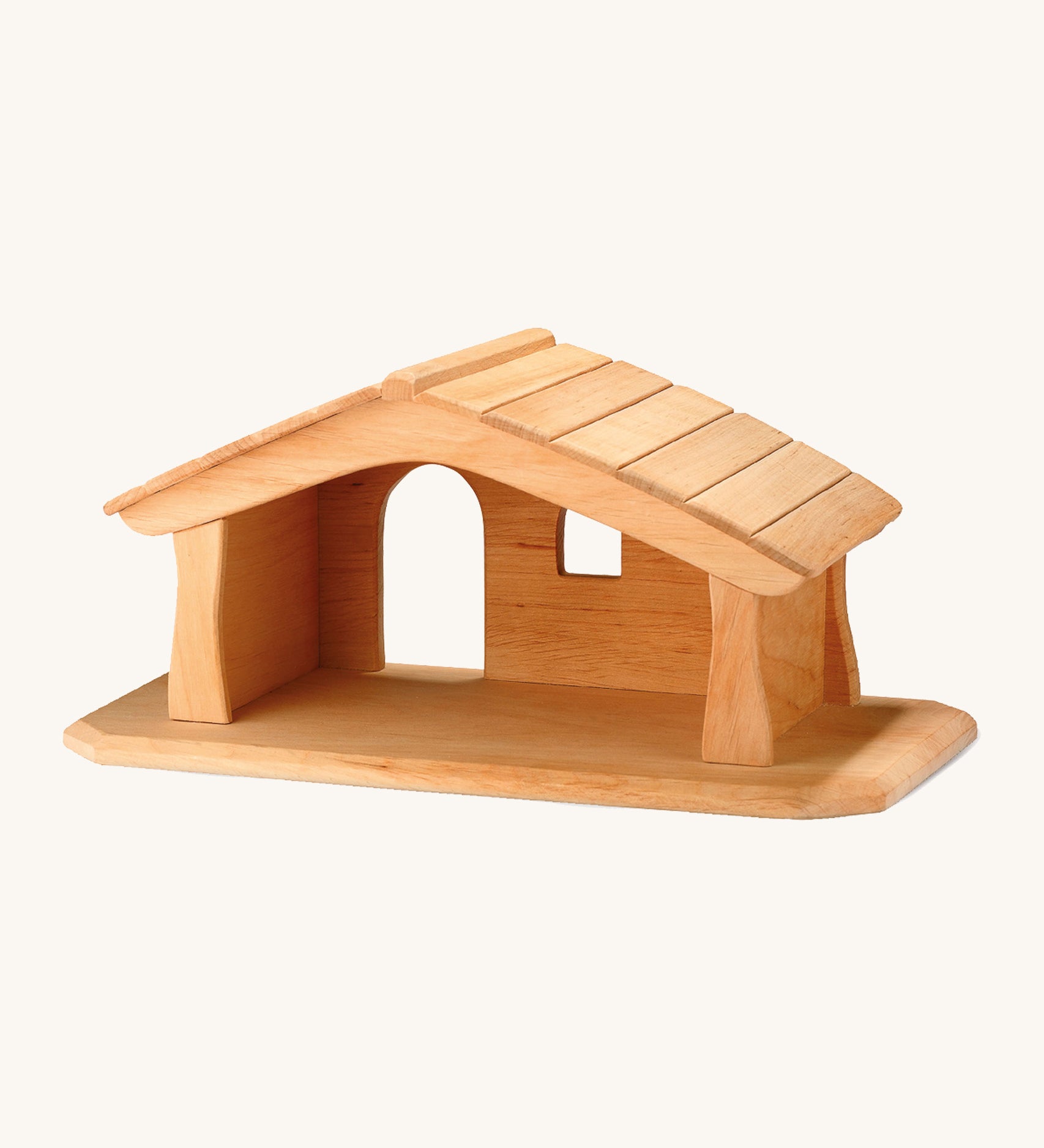 A small wooden Ostheimer stable on a cream background.