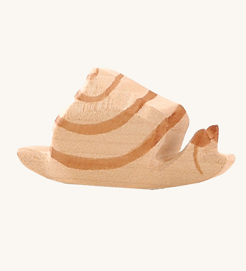 Ostheimer wooden snail figure on a plain background. 