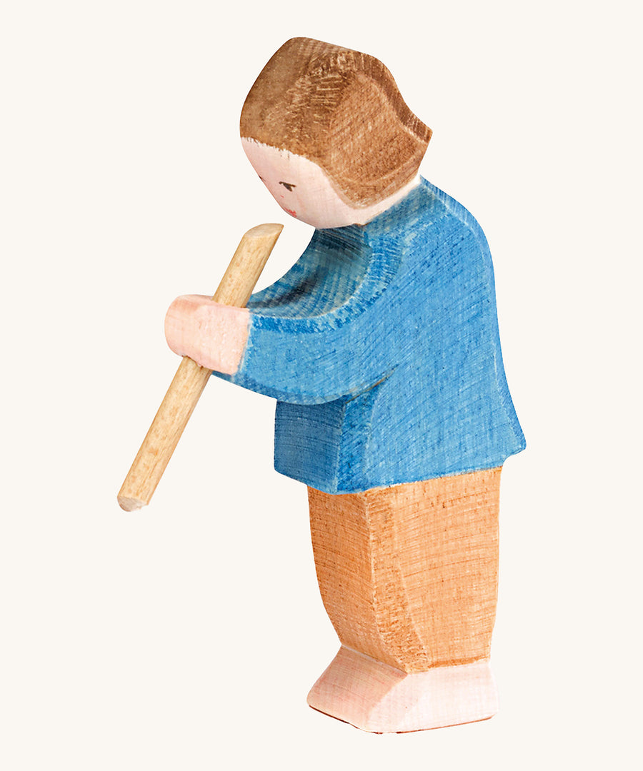 Ostheimer Son figure Playing Flute on a plain background. 