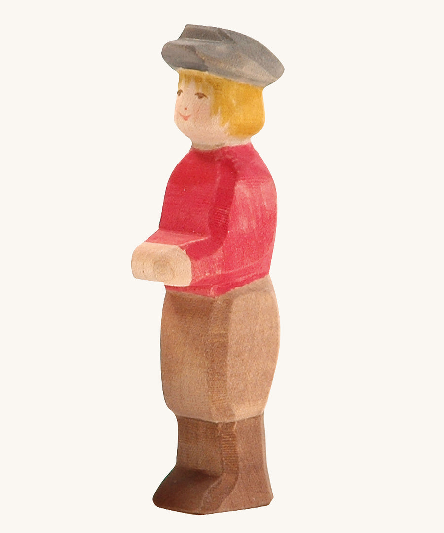 Ostheimer Son wooden figure with white Skin on a plain background. 